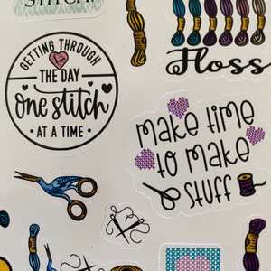 May include: A set of colorful stickers featuring embroidery and sewing themed designs. The stickers include phrases like "One More Stitch", "Getting Through The Day One Stitch At A Time", "Make Time To Make Stuff", and "Never Enough Floss".