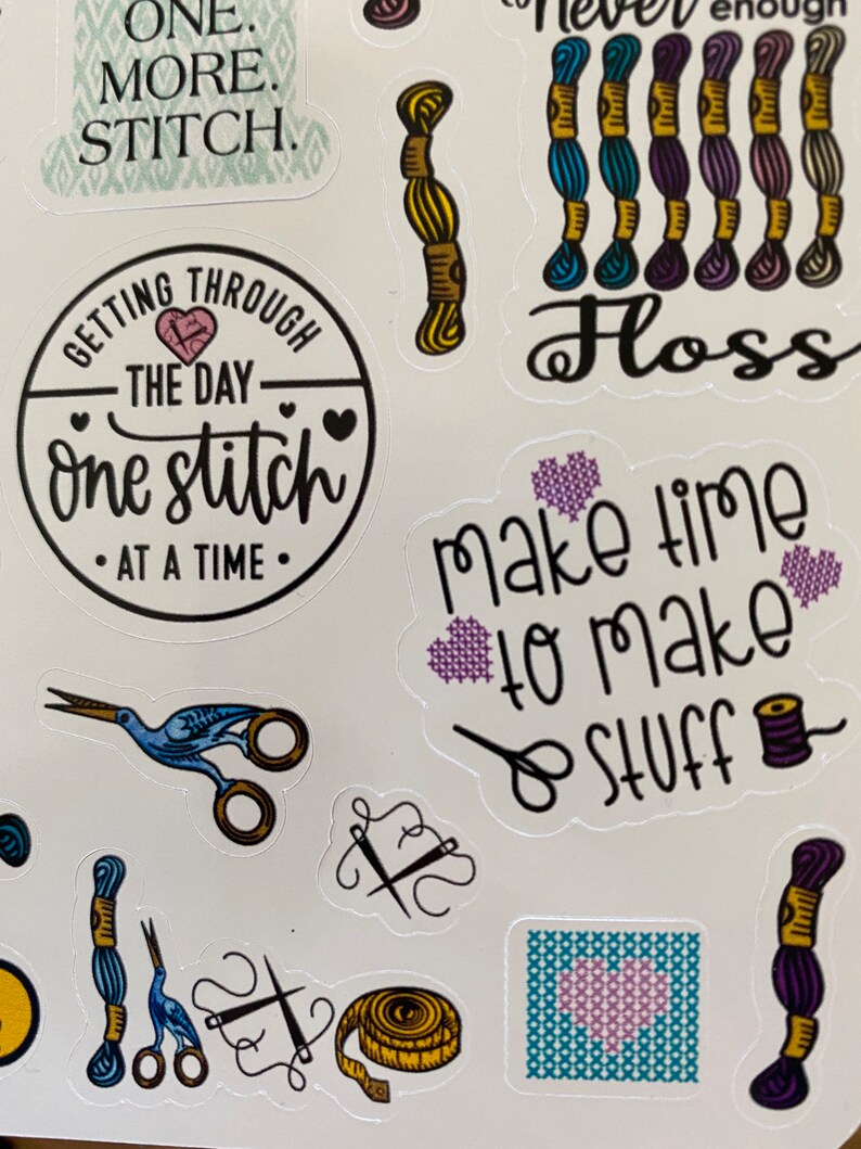 May include: A set of colorful stickers featuring embroidery and sewing themed designs. The stickers include phrases like "One More Stitch", "Getting Through The Day One Stitch At A Time", "Make Time To Make Stuff", and "Never Enough Floss".