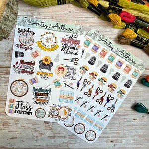May include: Two sticker sheets with embroidery-themed designs. One sheet features text like "Stitchery" and "Floss Everyday!" with images of embroidery hoops, needles, and thread spools. The other sheet has scissors, thimbles, and mushroom illustrations.