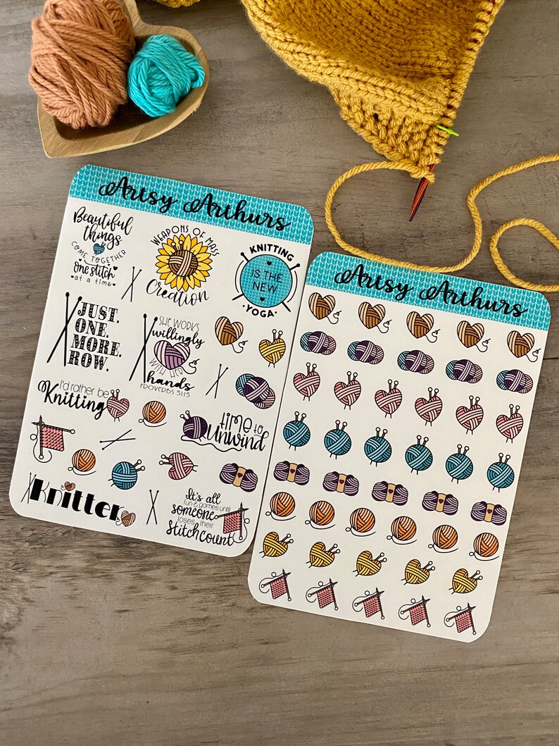 May include: Two sheets of stickers with a blue and white border. The stickers feature various knitting-themed illustrations, including yarn balls, needles, and hearts. The text on the stickers includes phrases like "Just one more row", "Knitting is the new yoga", and "Time to unwind".