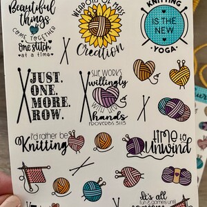 May include: A sheet of colorful stickers with knitting-themed designs. The stickers feature sayings like "Just one more row", "I'd rather be knitting", "Knitting is the new yoga", and "Time to unwind".