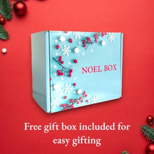 May include: A light blue gift box with a white snowflake and red berry design. The box has the text "NOEL BOX" printed on it. Free gift box included for easy gifting.