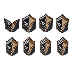 May include: Eight embroidered patches in various shapes and sizes, featuring a stylized design of a star and wings in shades of brown, black, and white.