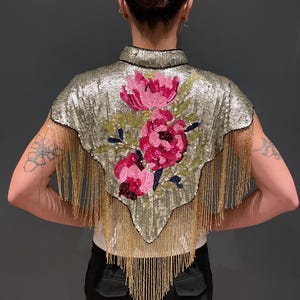 Tipperleyhill Sequin Cape  with floral hand designed  details and gold fringing
