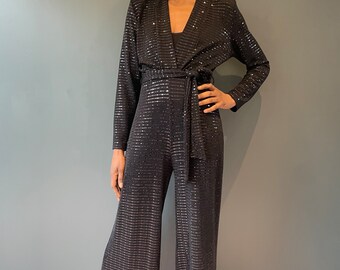 Schwarzer funkelnder Jumpsuit mit Karos und gepunkteten Pailletten