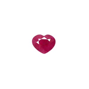 May include: A heart-shaped ruby gemstone with a deep red color.
