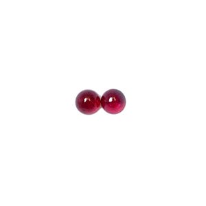 May include: Two round, red gemstones, likely rubies, are shown on a white background.
