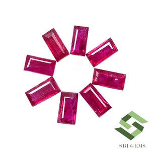 May include: Eight red ruby gemstones in a rectangular shape, arranged in a circle on a white background. The gemstones are all the same size and shape, and they are all polished to a high shine.