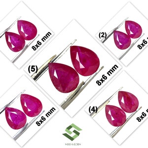 May include: Five pairs of pear-shaped ruby gemstones, each pair is held by tweezers and labeled with a number. Each pair is 8x6 mm.