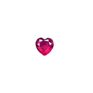 May include: A heart-shaped ruby gemstone with a deep red color.