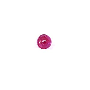 May include: A round, deep red gemstone with a smooth, polished surface.
