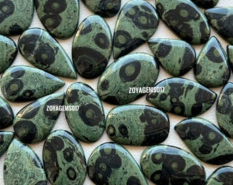 May include: A collection of 20 green and black gemstone cabochons with a unique swirling pattern. The cabochons are all different shapes and sizes, but they are all polished and smooth.