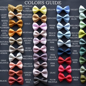 May include: A color guide for fabric swatches, displayed as bow ties. The swatches are arranged in rows and columns, with each color labeled with its name. The colors include antique white, light mint, white with gray flowers, white with color flowers, natural stripe, graphite stripe, gray melange, graphite, black, mustard with flowers, mustard melange, gold, mustard, melange brown sand, rose brown, natural melange, orange melange, ginger spice, brick red, yellow, capucine, prism pink, peach beige, melange pink, sea pink, pink black melange, pink ash, lilac, plum truffle, violet, cornflower blue, melange blue, turquoise blue melange, classic blue melange, ink blue, dark red, raspberry, royal red, nile green, mint, light green melange, lime, dark green melange, dark green, treetop green, sage green, khaki.