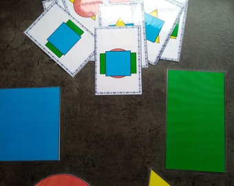 Stacking shapes. Fallow the pattern cards. Stack up the shapes according to the pattern card. Great learning activity.