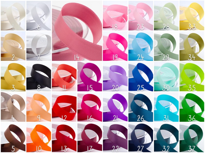 May include: A selection of ribbon spools in various solid colours. The ribbons include shades of pink, blue, and green, alongside neutral tones like beige and white. Each spool is labelled with a number.