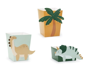 May include: Three party favour boxes featuring dinosaur and palm tree designs. The boxes are made from cardboard and decorated with colourful illustrations. The boxes are ideal for holding small treats or gifts.