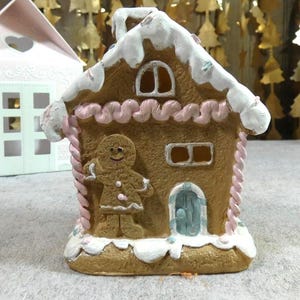 Small pretty gingerbread house glowing for a beautiful Christmas atmosphere 13 cm