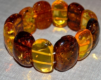 cognac cabochons Matt cabochons The bracelet is multicolored from natural Baltic amber Made of hard amber plates. white cabochons