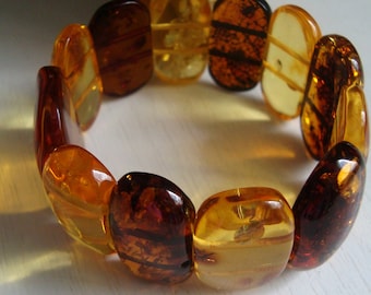 cognac cabochons Matt cabochons The bracelet is multicolored from natural Baltic amber Made of hard amber plates. white cabochons