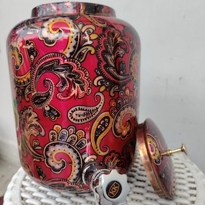 May include: A set of three ceramic mugs with a speckled, matte finish. Each mug features a different color: light blue, cream, and gray. The mugs have a simple, modern design and a comfortable handle.