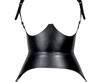 May include: Black leather corset with adjustable straps and a pointed, open-front design.