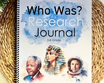 May include: A spiral-bound "Who Was? Research Journal" for grades 3-8, featuring illustrations of historical figures. The cover has a watercolor design and the journal is resting on a woven mat.