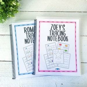May include: Two spiral-bound tracing notebooks. One has a blue border and says "ROMI'S TRACING NOTEBOOK". The other has a pink border and says "ZOEY'S TRACING NOTEBOOK". Both notebooks have tracing exercises with stars, numbers, and letters.