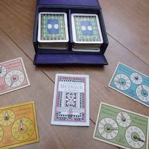 Antique Goodall & Son Bezique game. Complete with 4 decks playing cards, 4 markers and rules