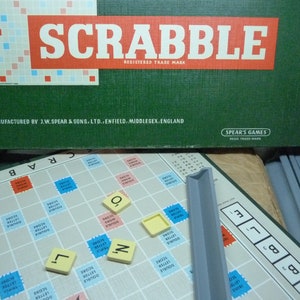 Vintage Scrabble board game by Spear's Games dated 1955. Complete original set: Board, racks and 100 letter tiles. Made in England word game With Grey racks