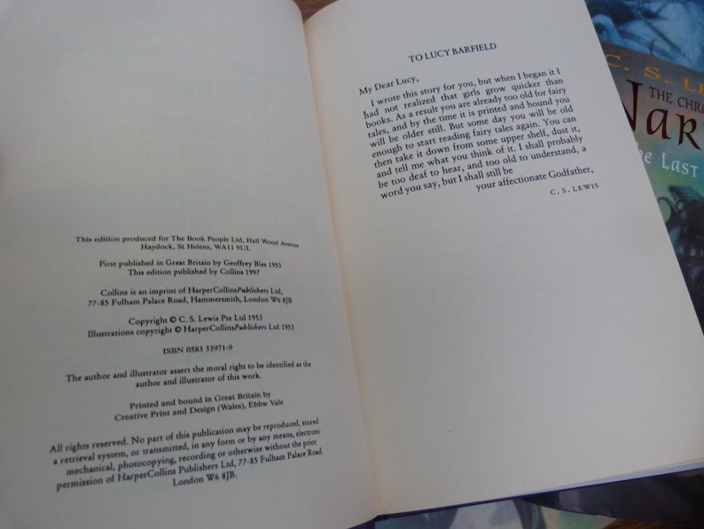 May include: A close-up of the dedication page of a book. The text reads "To Lucy Barfield" and includes a letter from C.S. Lewis to Lucy. The letter is dated 1953.