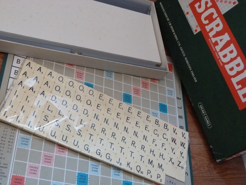 Vintage Scrabble board game by Spear's Games dated 1955. Complete original set: Board, racks and 100 letter tiles. Made in England word game With Sealed Letters