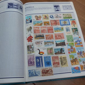 Vintage Stamp Album 1,400 World Stamps 1900s-80s Europe Africa Asia 150 pages Stamp Album