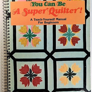 May include: A spiral bound book titled "You Can Be A Super Quilter!" with a colorful floral design on the cover. The book is a teach-yourself manual for beginners.