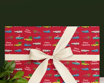 May include: Red gift wrap with a white ribbon and bow. The wrap features a repeating pattern of vintage cars with Christmas trees and candy canes. The text "Merry Christmas" is repeated throughout the pattern.