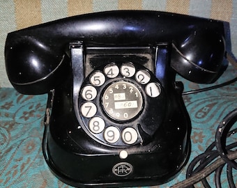 Black Bakelite telephone, PTT Belgium. 60s. Vintage. Dial. Ringtone. Special feature: carrying handle. Very well preserved.