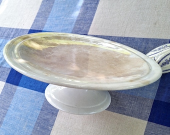 Large antique bakery cake stand, 1900. Wonderfully imperfect—askew, tea stains, chip. 33 cm (13 1/2 inches). Franco-Belgian. USA: DDP.