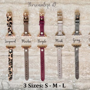 May include: A collection of watch bands in various colors and patterns, including russet, leopard print, mocha, purple, mink, gray, and black. Each band has a metal clasp and a decorative gem. The text "Personalize it!" and "3 Sizes: S - M - L" are also visible.
