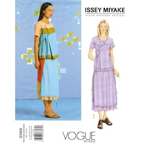 May include: A Vogue Patterns sewing pattern featuring designs by Issey Miyake. The pattern includes a color-blocked top and skirt ensemble. The model is wearing a light blue and orange top with a matching skirt. The text "ISSEY MIYAKE" and "VOGUE PATTERNS" are visible.