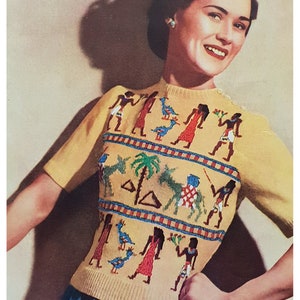 May include: A yellow knitted sweater with a colourful embroidered design featuring figures, birds, and palm trees.