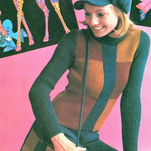 May include: A woman wearing a brown, blue, and black striped sweater with a long, dark blue strap. The sweater has a turtleneck collar. The woman is wearing a black hat and has long, blonde hair.