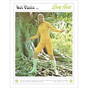 May include: Vintage fashion advertisement for "Hot Pants" by Lady Galt. The image features a woman wearing a yellow knit jacket and shorts set with white boots. The text reads "Hot Pants" and "Lady Galt". The background includes a large tree.