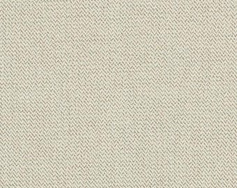 May include: Close-up of a beige fabric with a subtle herringbone weave pattern. The fabric has a neutral colour palette, with variations of light beige and off-white threads creating a textured surface. The weave is tightly constructed.