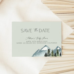 May include: A light green save the date card with a watercolor illustration of a mountain range with snow-capped peaks and evergreen trees. The text reads "SAVE the DATE, Allison's Baby Shower, WHEN 20TH MARCH XXXX, WHERE 123 MILLER AVE, ROSEWOOD CALIFORNIA."