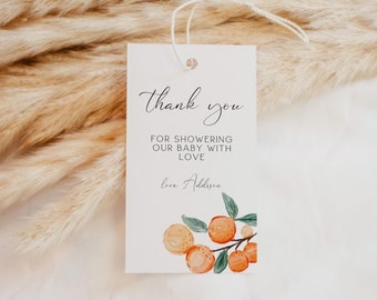Può includere: Biglietto di ringraziamento bianco con un'illustrazione ad acquerello di arance e foglie in arancione e verde. Il testo recita "Grazie per aver inondato il nostro bambino di amore Con affetto, Addison".