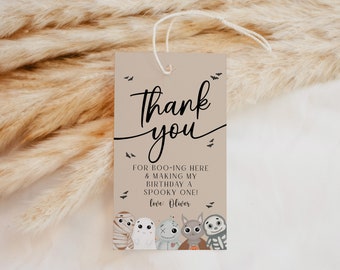 May include: A brown thank you card with a black handwritten message that says "Thank you" and "FOR BOO-ING HERE & MAKING MY BIRTHDAY A SPOOKY ONE! love: Oliver". The card features a cartoon illustration of five Halloween characters.