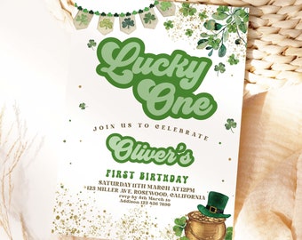 May include: A green and gold invitation for a first birthday party with the text "Lucky One" and "Oliver's First Birthday". The invitation features a shamrock design and a pot of gold.