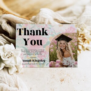 May include: A graduation thank you card with a floral design and a photo of a smiling graduate. The card reads "Thank You" in large black letters, with a personalized message and name.