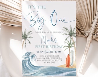 Puede incluir: Una invitación de primer cumpleaños de temática playera en azul y blanco para un niño llamado Noah. La invitación presenta una ilustración de acuarela de olas del océano, palmeras y tablas de surf. El texto dice "It's the Big One, Please join us to celebrate Noah's First Birthday, 08 Sat April 10am, Mason Beach House, 123 Redwood, California, RSVP Megan by April 5th, 123 456 7890."