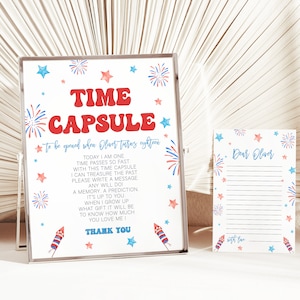 May include: A white sign with red and blue fireworks and stars, with the text "TIME CAPSULE to be opened when Oliver turns eighteen".  The sign also includes instructions for writing a message to be opened in the future.  A smaller white card with red and blue fireworks and stars says "Dear Oliver".