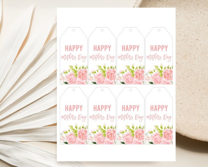 May include: Eight printable gift tags featuring a floral design and the text "HAPPY Mothers Day" in pink lettering.